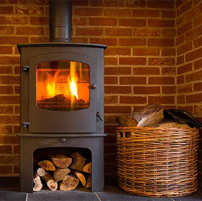 Modern design wood burning stove with wood and a basket