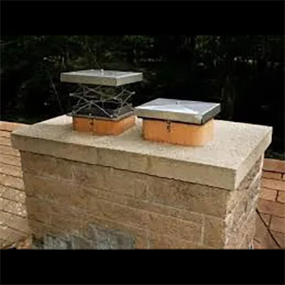 Stock photo of two chimney caps - West Tennessee Chimneys Two chimney caps sitting on top of chimney lining - West Tennessee Chimneys