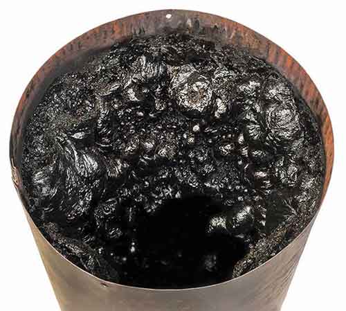 Stock photo of creosote buildup removal from chimney lining - West Tennessee Chimney Creosote buildup removal from chimney lining - West Tennessee Chimney
