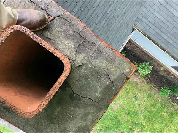 Crumbling crown with man's foot in picture 