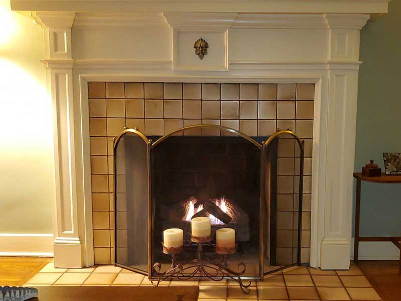 Beautiful white fireplace surround with tile and gas fireplace - West TN Chimney