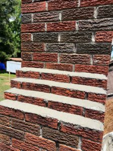 Masonry Repair of a chimney with different colors of brick - West Tennessee Chimney