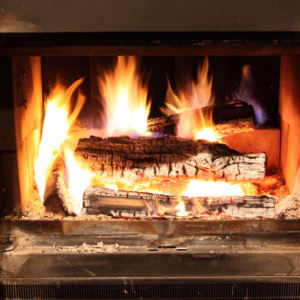 a close-up view of wood burning in a firebox