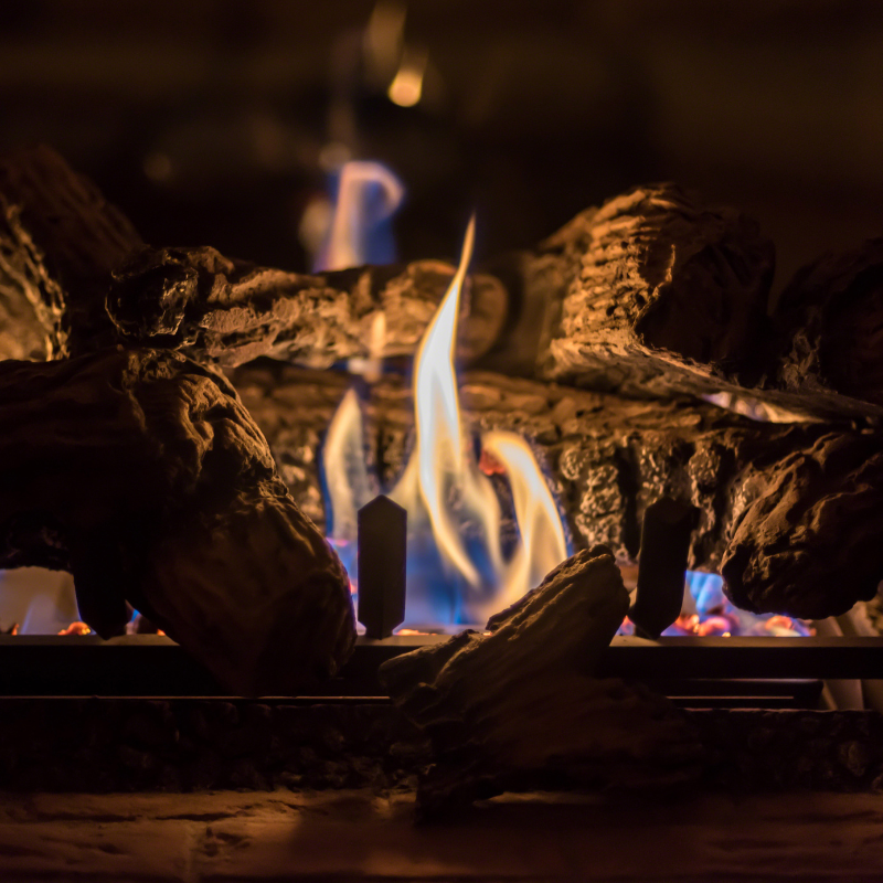 stock photo of gas logs close up shot of lit realistic-looking gas logs
